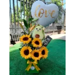 Arreglo de 5 girasoles con peluche de palta