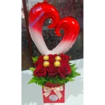 Arreglo caja de 9 rosas con Ferrero